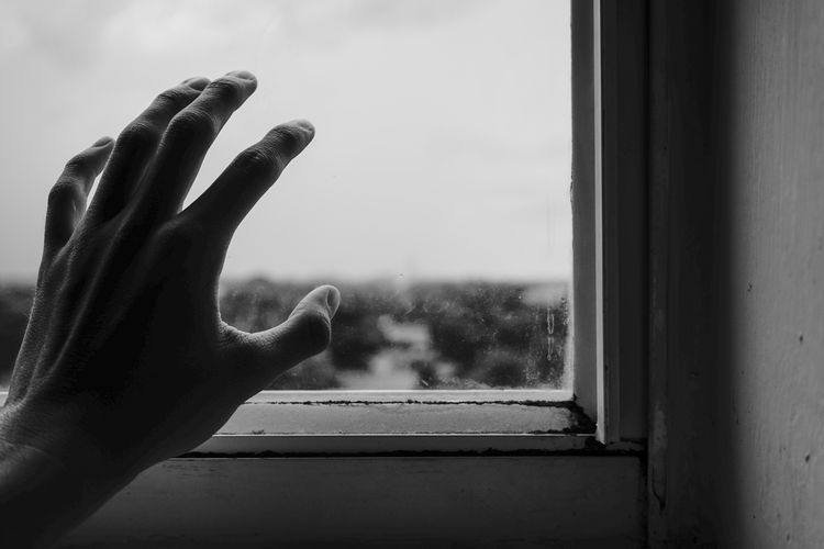 Hand at window