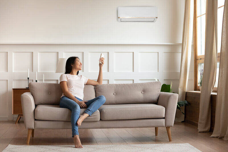 happy woman heat pump on