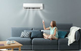 Woman using Mitsubishi Electric air conditioner